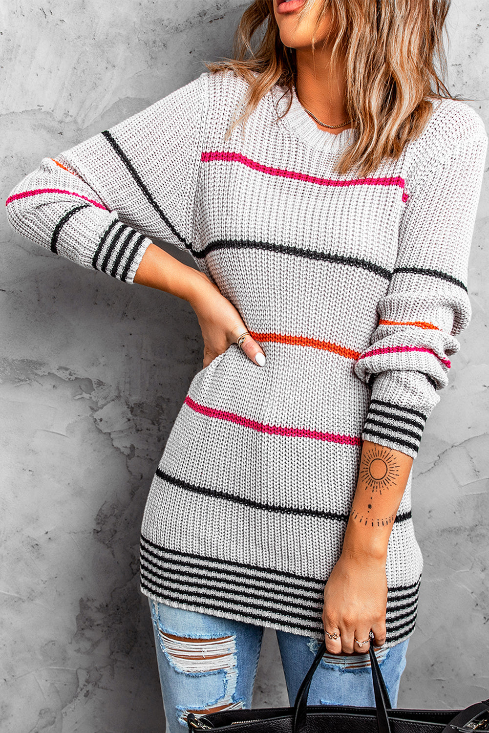 Gray ribbed knit striped sweater from Harlequin Daisy, showcasing its cozy, textured fabric and stylish design.