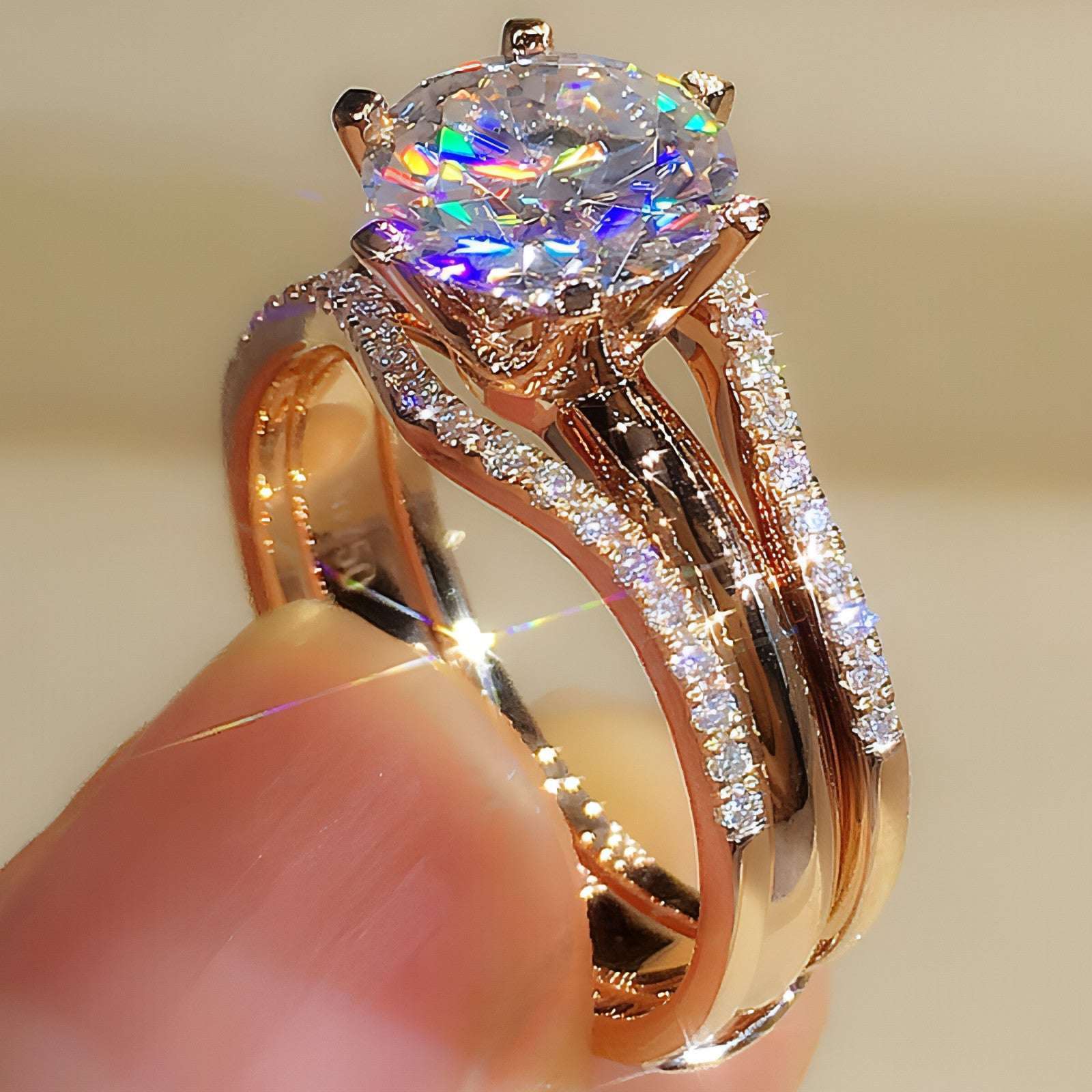 Pair of 18K gold moissanite rings from Carmine Juneberry, showcasing elegant and versatile ring designs.