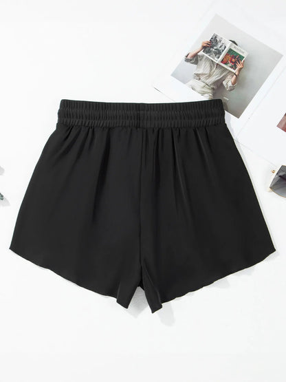 Pear Daisy high waisted drawstring swim shorts for women, featuring a stylish fit and comfortable waistband, perfect for beachwear.