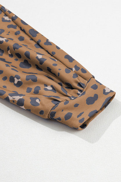 Brown printed raw edge leopard patchwork oversized blouse from Carmine Juneberry, featuring bold animal print and relaxed fit.