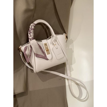 Carmine Juneberry CityEdit™ Litchi Luxe Tote with scarf handle, stylish tote bag with textured litchi pattern and elegant scarf detail.