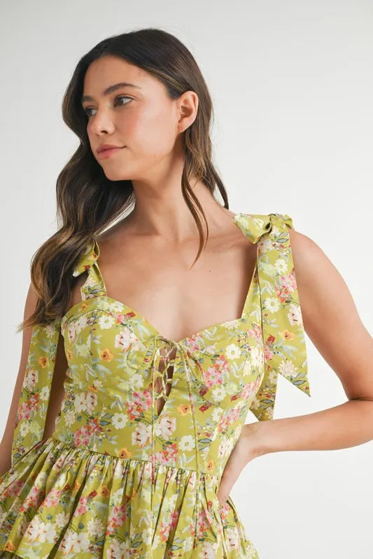 Pear Daisy MABLE floral print layered mini dress with shoulder tie, featuring vibrant flower patterns and a flowing silhouette.