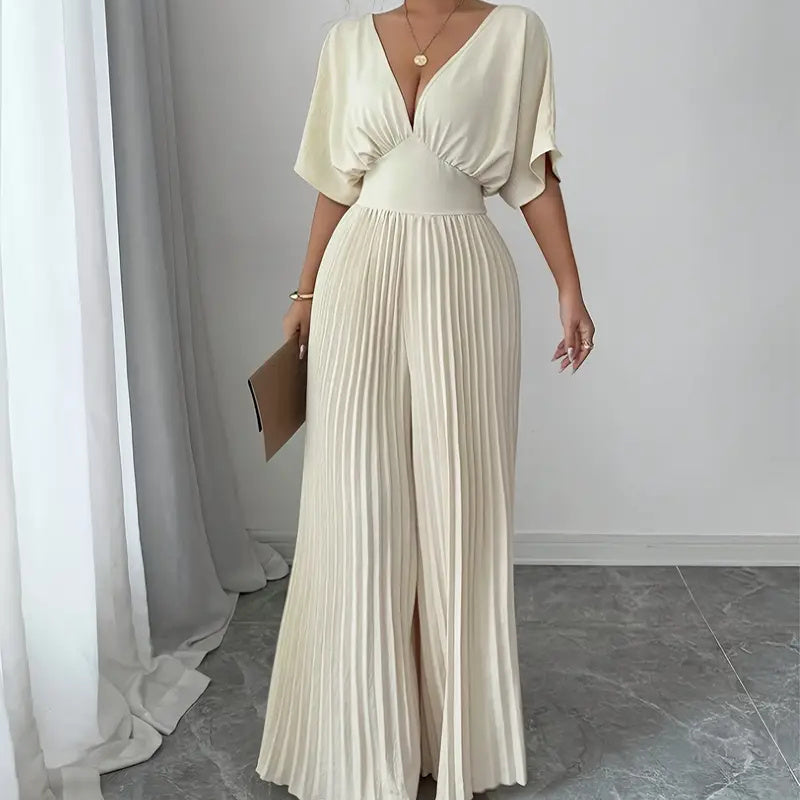 Carmine Juneberry 25 Edition pleated wrap-style maxi dress, flowing fabric, and elegant design showcased in the image.