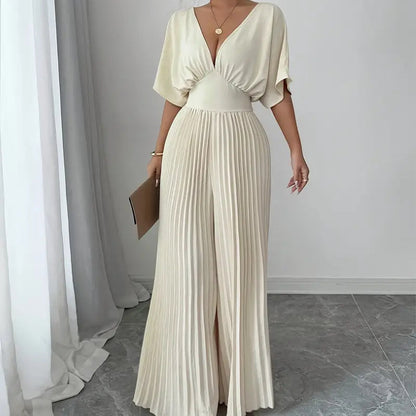 Carmine Juneberry 25 Edition pleated wrap-style maxi dress, flowing fabric, and elegant design showcased in the image.