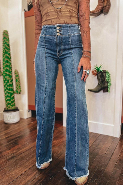 Sail blue high waist flare jeans with button fly, seamed details, and raw hem by Carmine Juneberry.