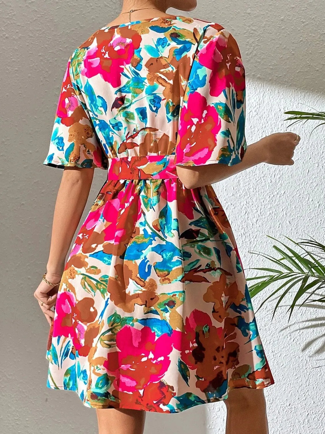 Ruby Styx printed surplice short sleeve mini dress for women, featuring a stylish and comfortable design.
