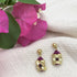 A pair of Keya Flower earrings by Ariel featuring handcrafted floral design in vibrant colors on silver hooks.