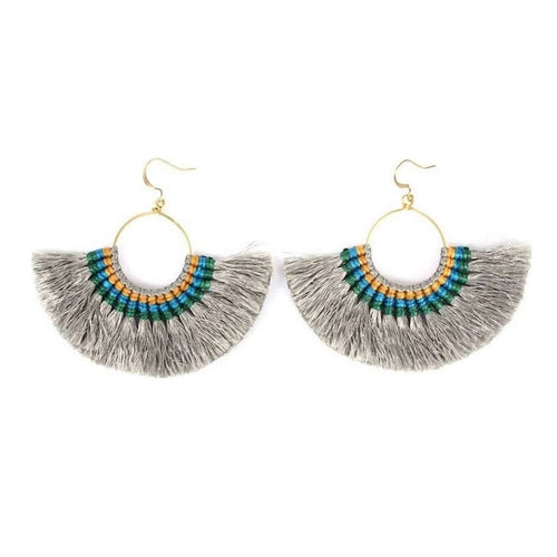 A pair of colorful silk tassel fan earrings by Ariel, featuring vibrant tassels hanging from gold-tone hooks.