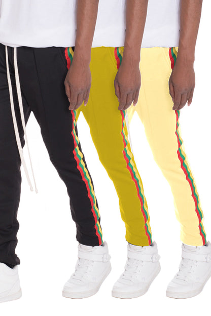 Lime Milo Rasta track pants featuring colorful Rastafarian-inspired patterns and comfortable athletic fit.