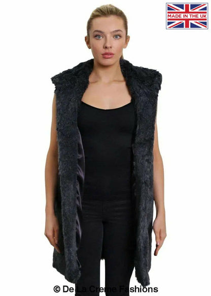 Grey faux fur hooded gilet by Rose Eleusis, stylish sleeveless jacket with plush fur hood, perfect for layered winter fashion.