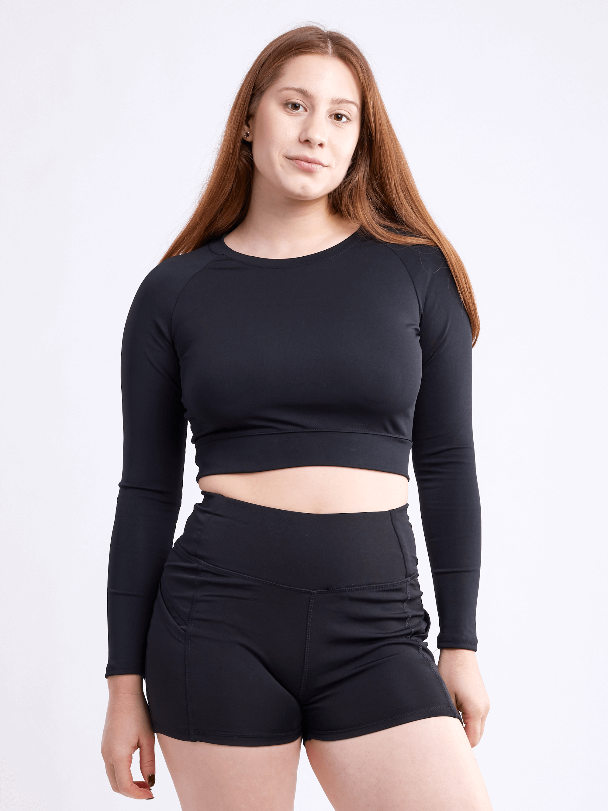 Black Lavender JupiterGear long-sleeve crop top in activewear style, featuring a fitted design and athletic fabric.
