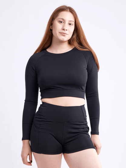 Black Lavender JupiterGear long-sleeve crop top in activewear style, featuring a fitted design and athletic fabric.