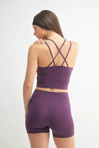 Automotive part showing a jade Icarus branded component with a crisscross design, labeled Venice Cloud Light for MONO B sports bra.