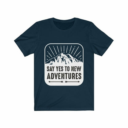 Plum Charlie Say Yes to New Adventures T-shirt with motivational print, casual fit, and soft fabric, displayed on a hanger.