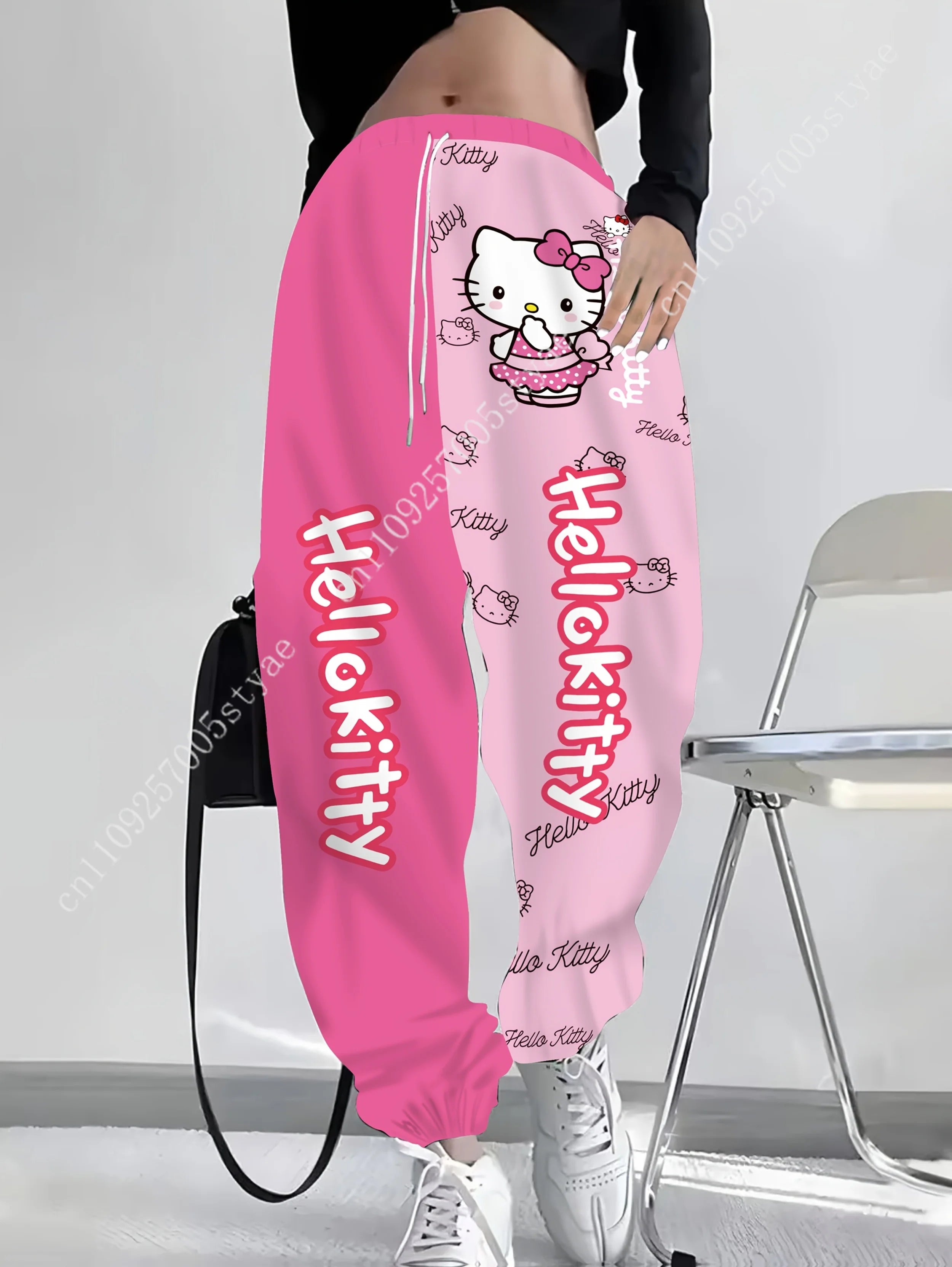 Hot pink and light pink Hello Kitty cartoon long pants with polka-dot bow print and split-color design, for ladies by Start2Finish.