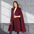 Carmine Juneberry Urban Cloak Cape Coat 25 Edition, stylish jacket with a flowing silhouette and modern design, worn outdoors.