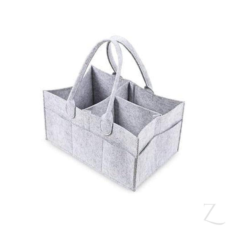 Grey felt nappy organizer caddy from Raspberry Pallas with multiple compartments, perfect for organizing baby essentials.