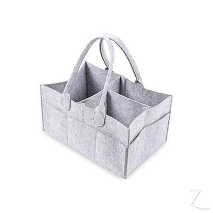 Grey felt nappy organizer caddy from Raspberry Pallas with multiple compartments, perfect for organizing baby essentials.
