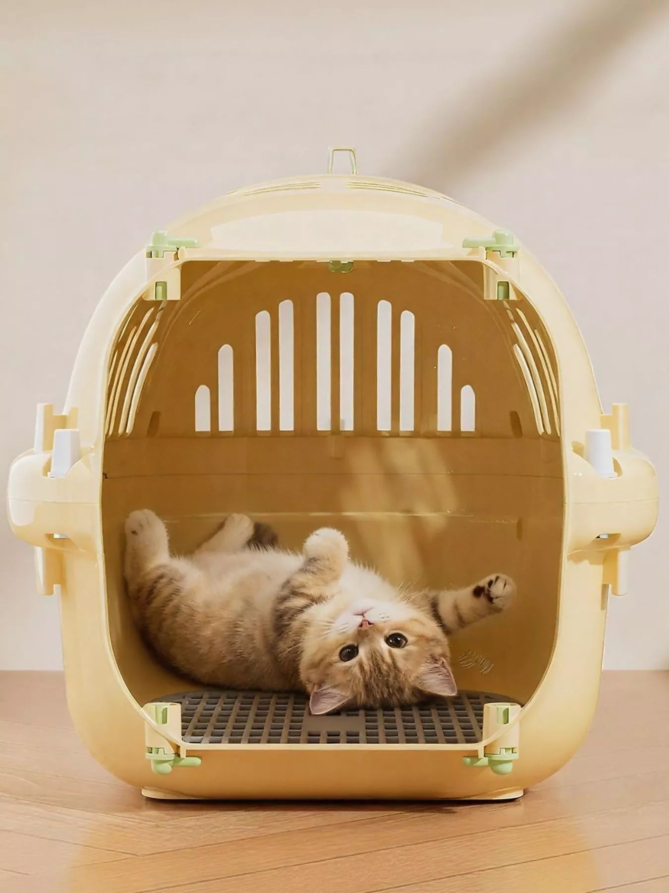 Portable ventilated pet carrier travel cage by Pear Daisy with mesh sides and secure door for comfortable pet transport
