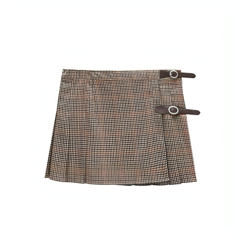Carmine Juneberry pleated skirt with flowing fabric and a high waist, showcased on a model against a neutral background.