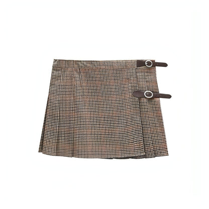 Carmine Juneberry pleated skirt with flowing fabric and a high waist, showcased on a model against a neutral background.