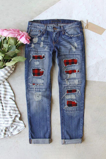 Distressed straight jeans with buffalo plaid patches by Harlequin Daisy, casual denim with stylish patchwork detail.