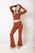 Periwinkle Aether flared lounge pants in copper, showcasing their relaxed fit and stylish design from the Leto collection.