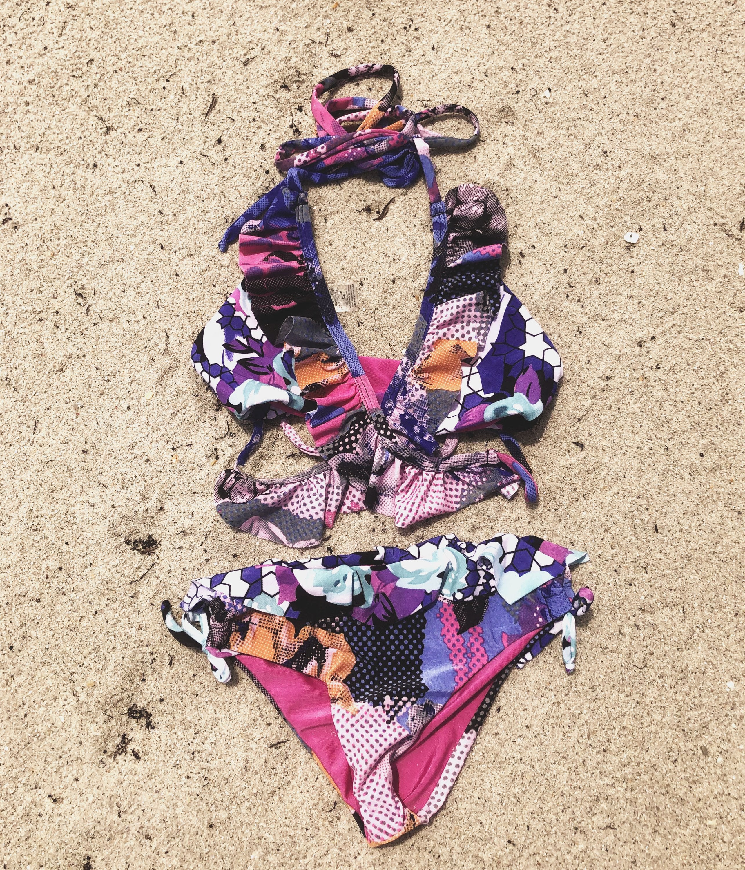 Bright flower passion bikini for kids by Bronze Tartarus featuring colorful floral patterns and comfortable swimwear design.