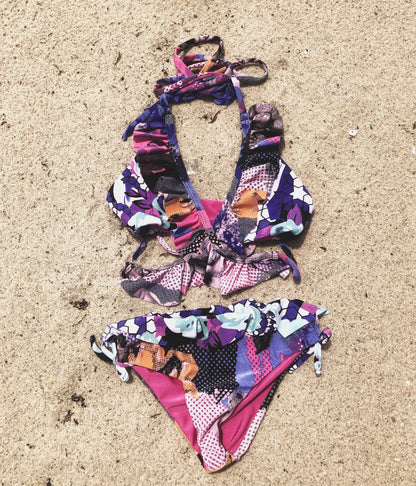 Bright flower passion bikini for kids by Bronze Tartarus featuring colorful floral patterns and comfortable swimwear design.