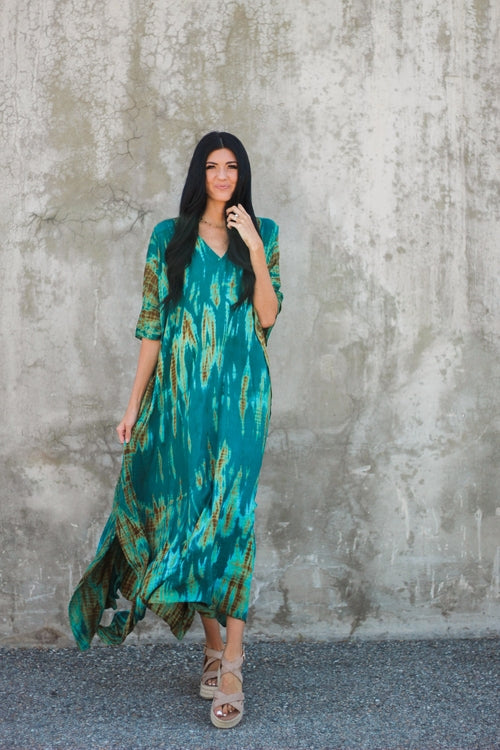 Plus size teal green tie-dyed kaftan dress by Erin Pontus, front view with V-neck and vibrant hand-dyed pattern.
