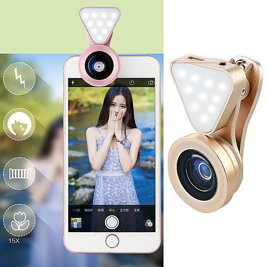 Salmon Lucky Glow Face 3-in-1 photo lens and fill lighting clip attached to a smartphone for enhanced selfies and photography.