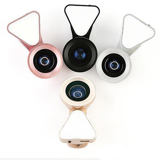 Salmon Lucky Glow Face 3-in-1 photo lens and fill lighting clip showing a compact tech accessory for mobile photography.
