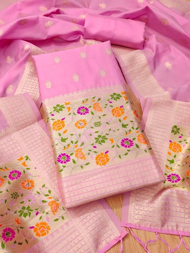 Elegant baby pink Banarasi dress material for women by Brown Lelantos, showcasing intricate woven patterns and rich fabric.