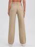 Women’s beige high-rise denim jeans by Ochre Ourea, size 32, shown folded with front pockets and belt loops.