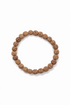 Natural Rudraksha bead stretch bracelet from Pear Smudge featuring round beads on an elastic band, ideal for spiritual jewelry.