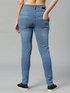 Women’s high rise blue denim jeans by Ochre Ourea, size 32, displayed on a hanger.