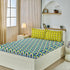 Teal cotton Peacock King bedsheet by Violet Achilles with intricate peacock feather design, perfect for elegant bedroom decor.