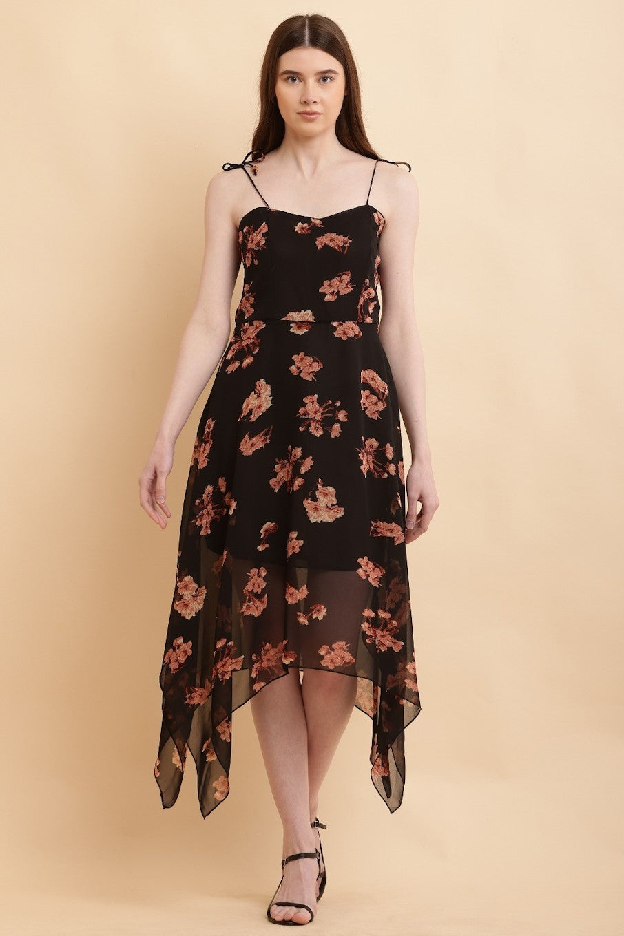 Black leopard print handkerchief hem dress for women by Harlequin Coco, size M, featuring a flowing silhouette and stylish pattern.