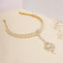 Beige Eros Kundan hairband with intricate design and matching mang tika, traditional Indian accessories for special occasions.