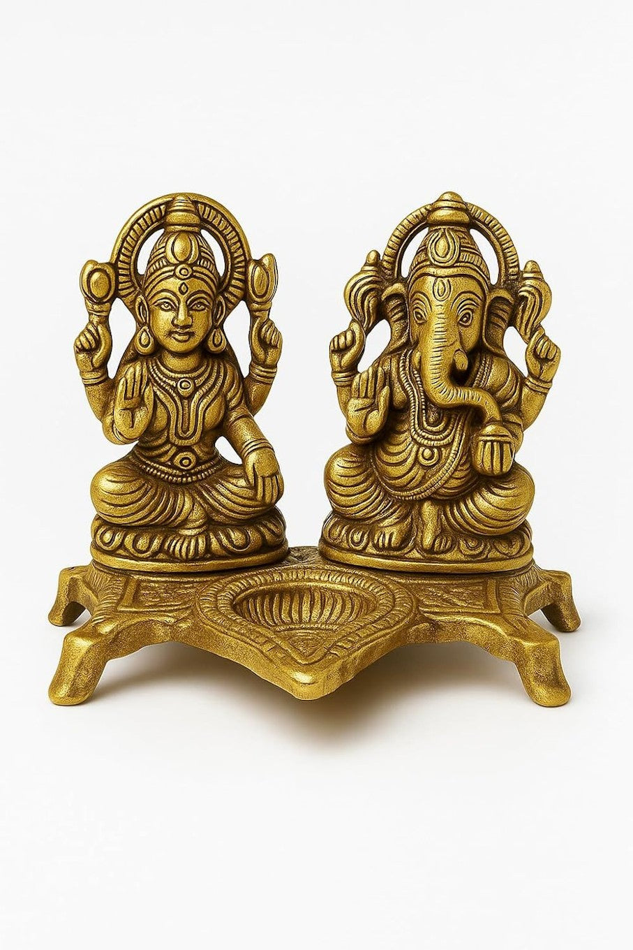 Lakshmi Ganesh idol with diya, decorative accessories from Erin Hera, featuring detailed craftsmanship and vibrant colors.