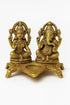 Lakshmi Ganesh idol with diya, decorative accessories from Erin Hera, featuring detailed craftsmanship and vibrant colors.
