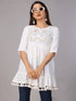 Women’s white embroidered fit and flare rayon tunic by Raspberry Abderus, showing intricate embroidery and flowing fit.