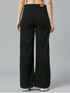 Women’s high rise black denim jeans by Ochre Ourea, showing the fitted style and classic five-pocket design.