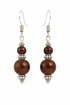 Handcrafted wooden bead drop earrings from Ruby Oscar, featuring natural wood beads and elegant dangle design.