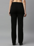 Women’s high rise black denim jeans by Ochre Ourea, size 30, showing the fit and classic style of the denim fabric.
