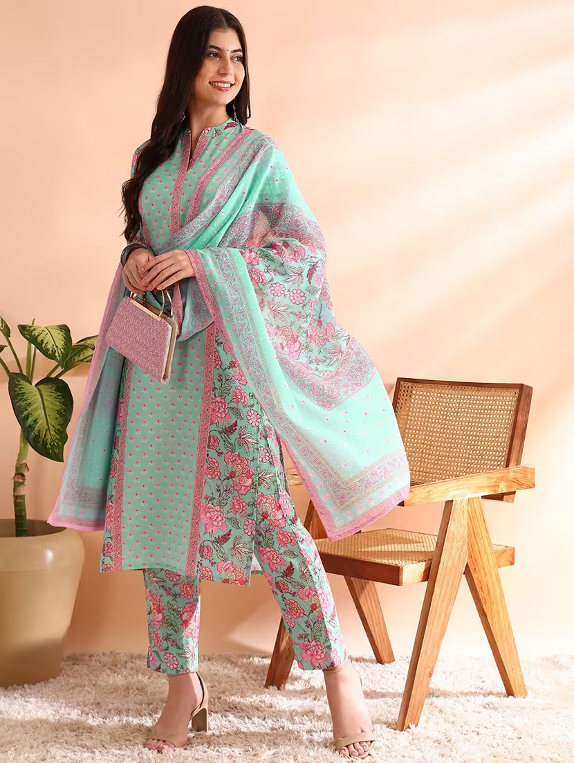 Women’s turquoise floral printed suit set by Viridian Pontus, featuring a stylish, coordinated top and pants in vibrant floral print.