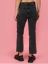 Women’s black high rise denim jeans by Ochre Ourea, size 32, shown on a model with front view and classic five-pocket design.