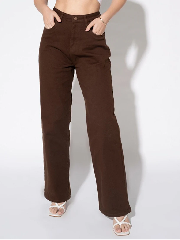 Women’s high rise brown denim jeans by Ochre Ourea, size 28, featuring classic five-pocket design and belt loops.