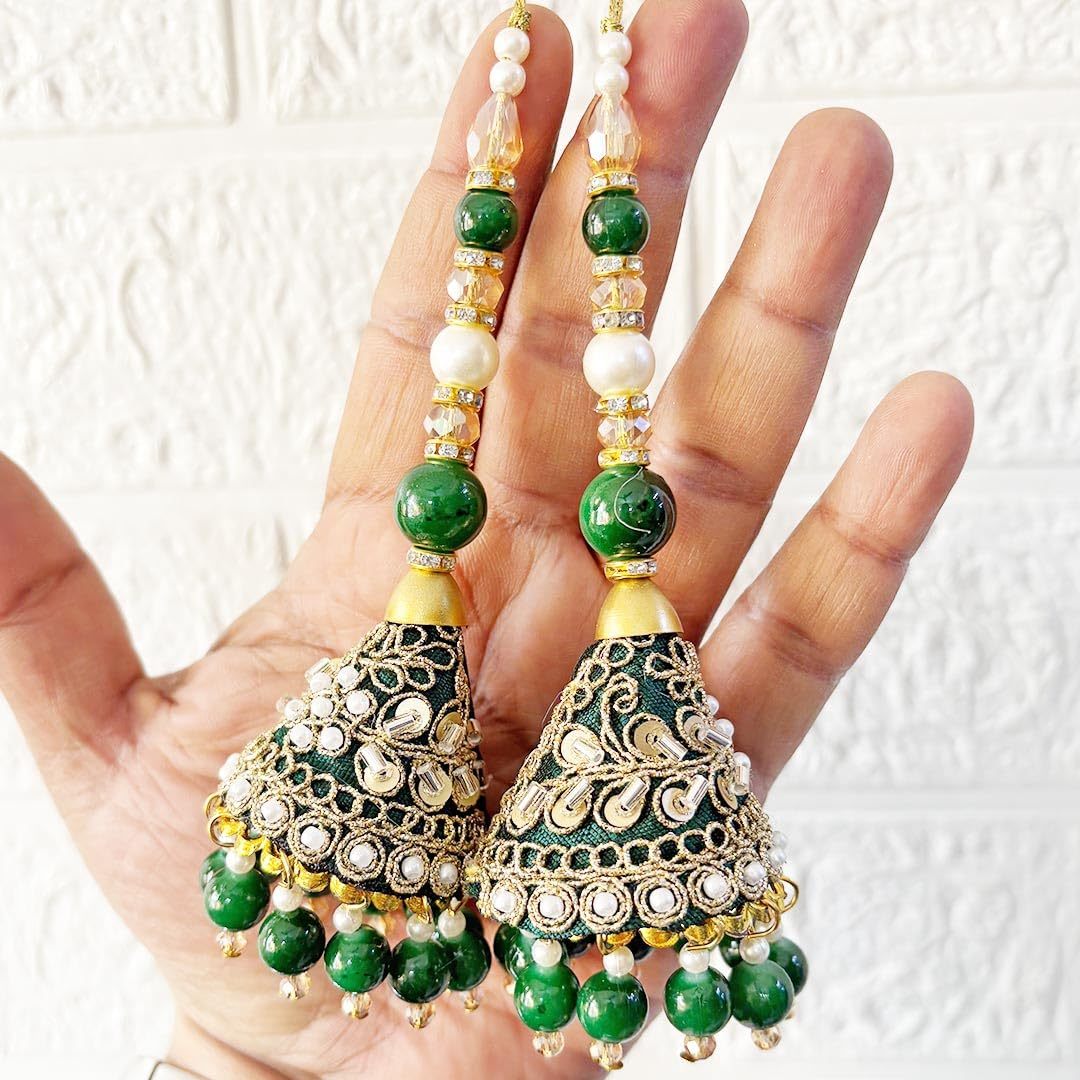 Jade Simba ethnic latkan for lehenga choli featuring intricate gold and colorful embellishments, hanging decorative accessory.