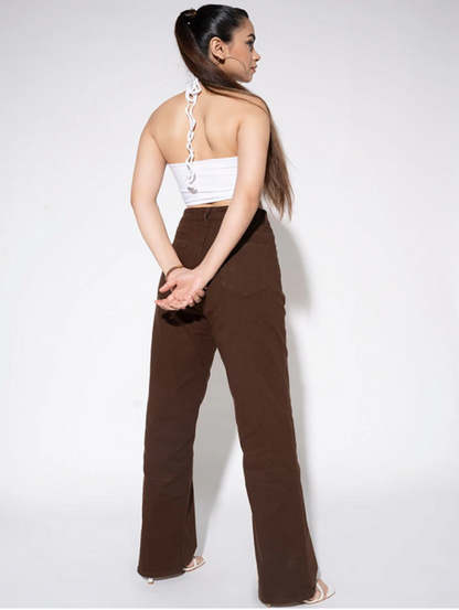 Women’s high rise brown denim jeans by Ochre Ourea, size 28, displayed on a model showing front view.